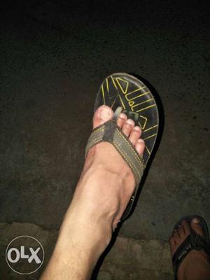 Unpaired Black And Yellow Flip-flop