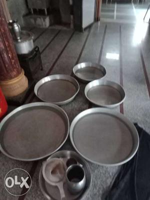 Five Round Grey Plates