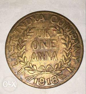 Round  Gold-colored UK One Anna Coin