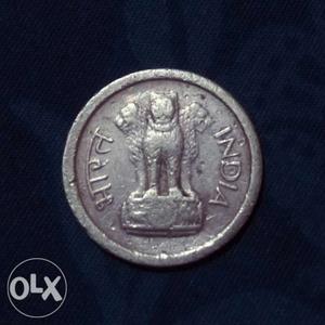 Round Silver-colored Coin 1 paisa