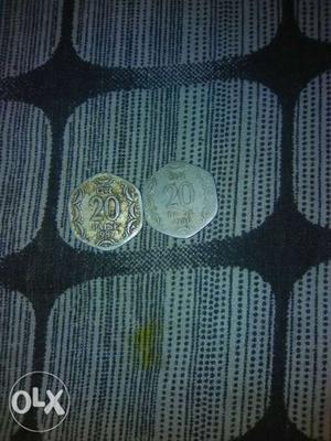 Two Gold-and-silver-colored 20 Indian Paise Coins