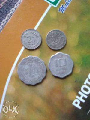 Two Silver-colored 25 And 10 Indian Paise Coins