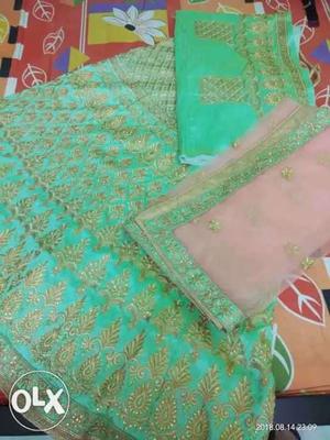 Beautiful green and pink semi stiched lahenga for Sale