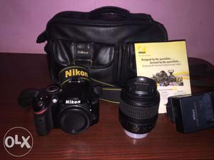 Black Nikon DSLR  Camera With Bag