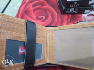 Light brown genuine leather wallet...brand new..packed
