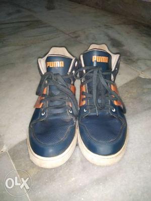 Pair Of Black-and-orange puma Shoes