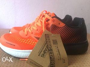 Pair Of Orange HEALTH brand sport shoes