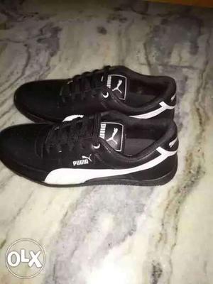 Puma black and white shoes.. Size 7