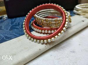Several Beaded Red And Gray Silk-thread Bangles