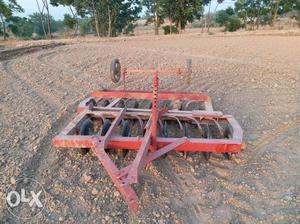 Two Red Cultivator Trailers