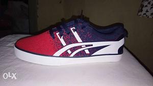 Unpaired Red And Black ASICS Low-top Sneaker