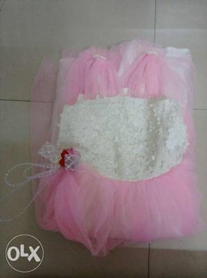 A pink net sleeveless gown for 9 year girl