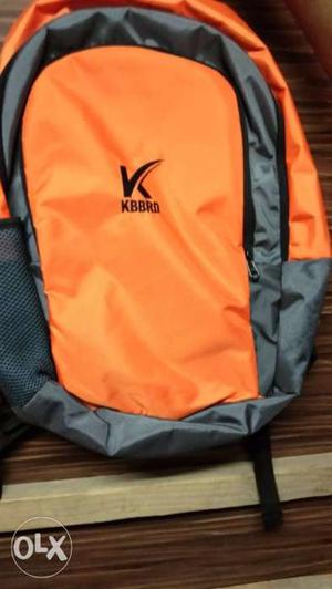 Bright orange bagpack with 1 year warranty