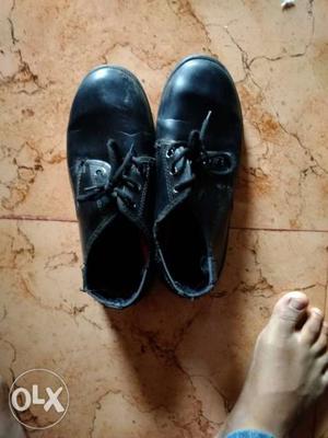 Pair Of Black Leather Shoes