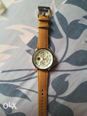 Round Gold Chronograph Watch With Brown Leather Strap