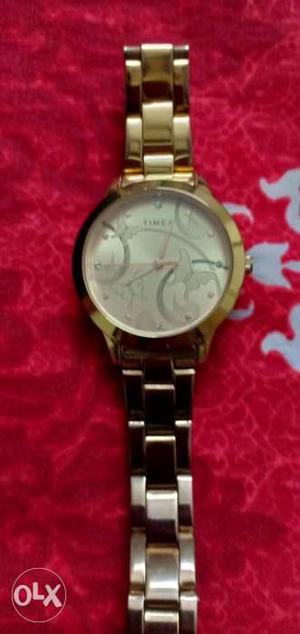 Timed Rose Gold colour watch which is still under warranty