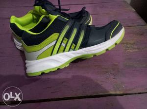 Unpaired Green And Black Adidas Running Shoe