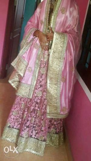 Women's Pink And gold bridal lehanga One tym used MRP. 