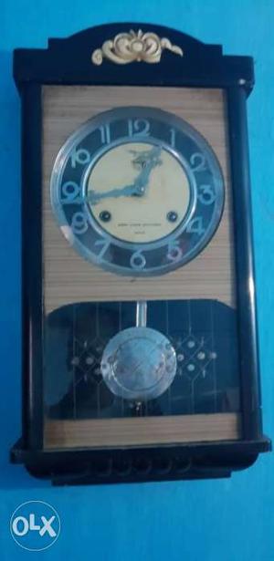 Beige And Brown Wooden Pendulum Clock 0f s clock working