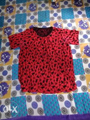 Red top with nice design and comfortable touch.