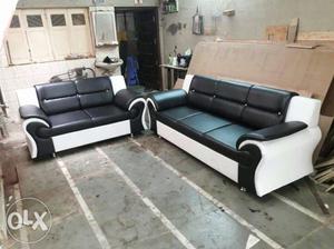 Two Black Leather 2-seat Sofas