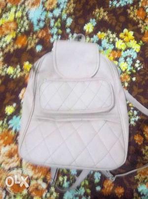 White And Gray Leather Backpack
