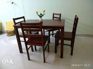 Brand New Dinning Table with 4 chairs. Owner got