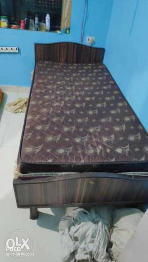Brown wooden Bed with Mattress for sale. Size: