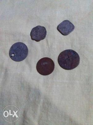 Four Round Black And Gray Coins