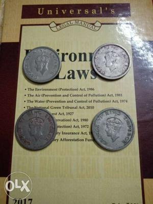 Four  coins of One Rupee Denomination.