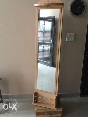 Revolving dressing table with cabinet at the back