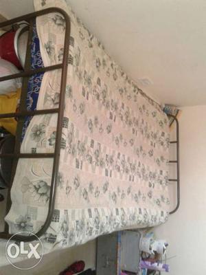 Steel cot with cotton mattress