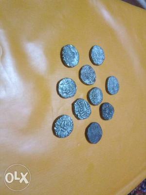 Ten Round Silver-colored Coins