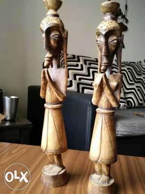Two Brown Wooden Man Figurines
