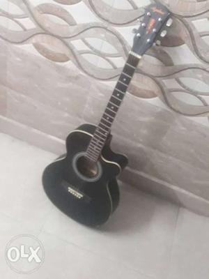 Acoustic guitar in good condition, with guitar