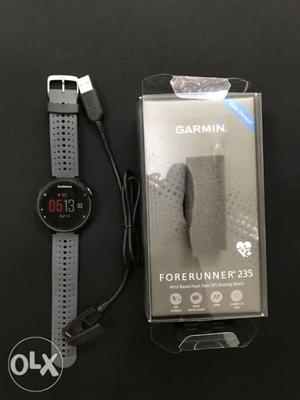 Garmin FR235 Fitness Watch with box and bill.