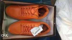 Pair Of Orange Adidas Low-top Sneakers