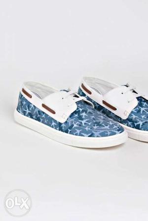Pair Of White-and-blue Slip On Shoes