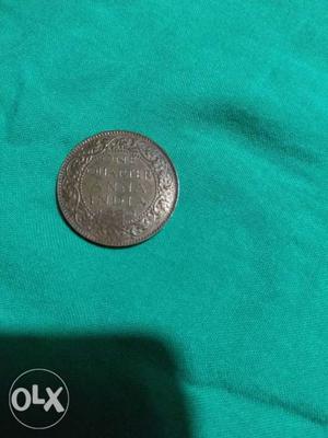 It is a bronze coin. Year . George VI king