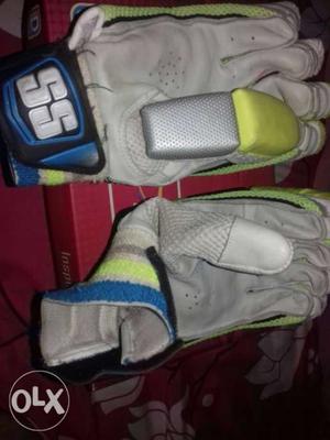Pair Of Gray-and-green Nike Gloves