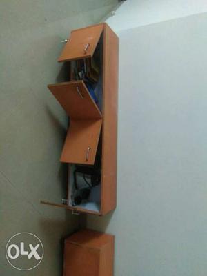 TV base with shelf made of wooden ply with still legs