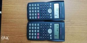 Two Black Texas Instruments TI-84 Plus