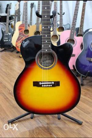 Yellow And Black Cutaway Acoustic Guitar On Gray Guitar