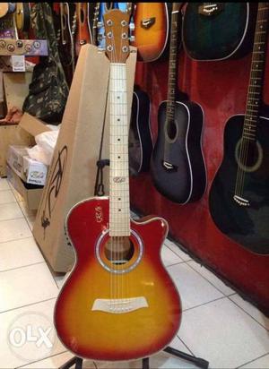 Yellow And Red Cutaway Acoustic Guitar