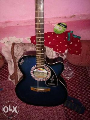Guitar in good condition with belt and speaker connectivity
