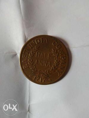Round  Bronze-colored Indian Half Anna Coin