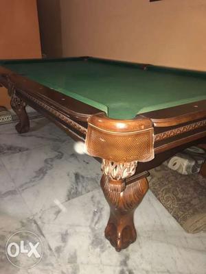 An imported Walnut finish pool table