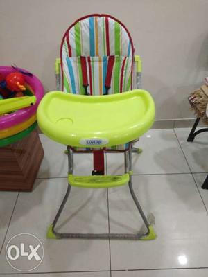 Baby's Green And White High Chair
