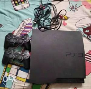 Black Sony PS3 Console With 2 Controllers And one game