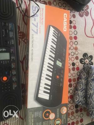 Casio SA-keys with adapter and cover bag in